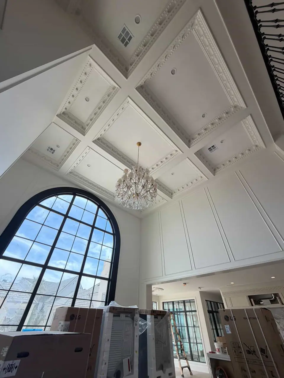 Detailed coffered ceiling and wall paneling in progress