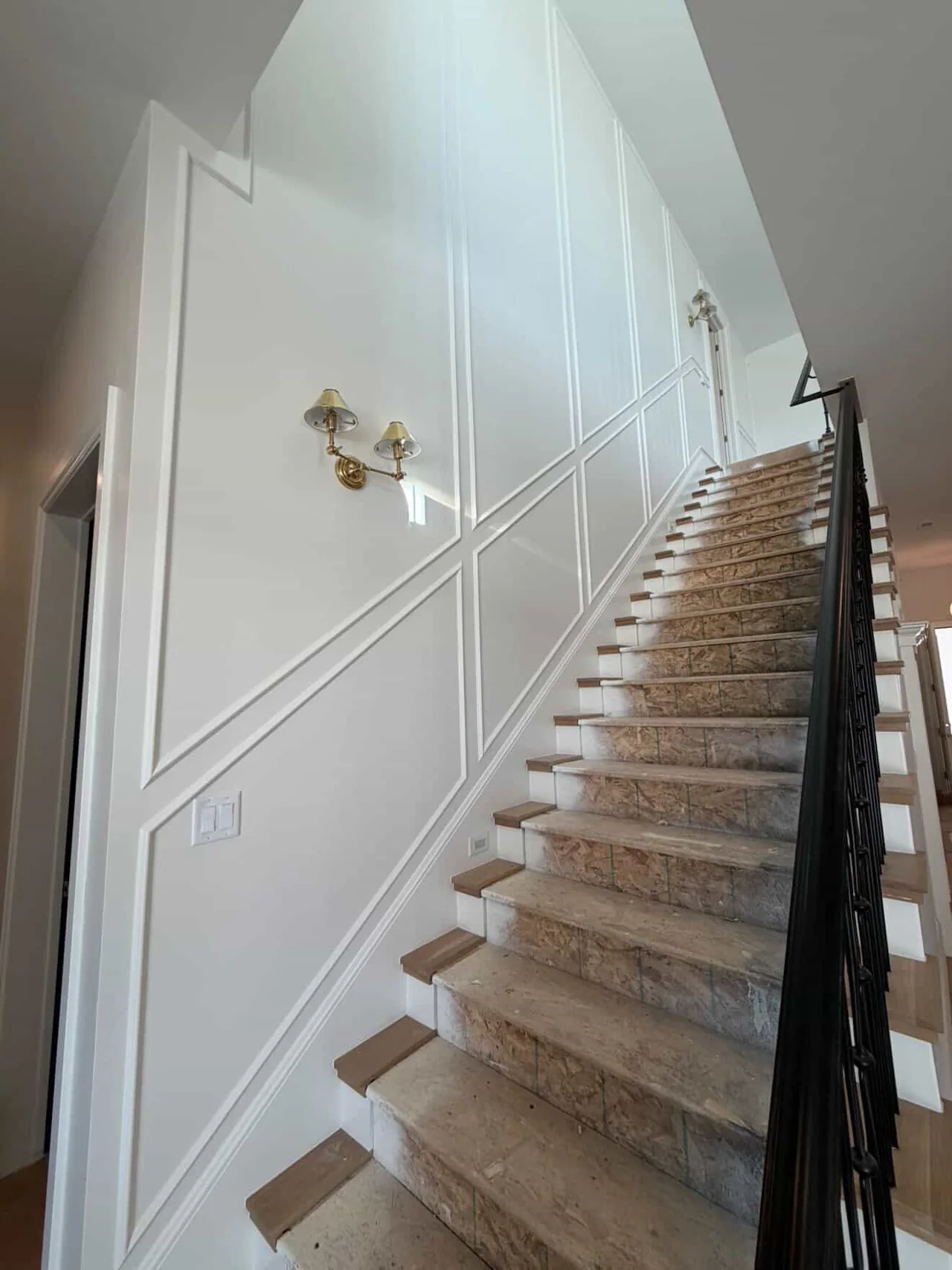 Finished staircase and paneled wall detail